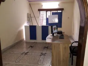 A room at the FILP centre with a noticeboard and desk