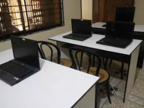 Laptops set out on the training room desks