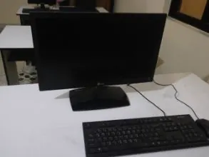 A monitor and keyboard at a training desk